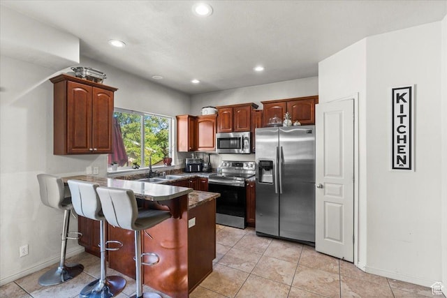 6731 S Ticklegrass Rd W, West Jordan, UT 84081 - kitchen featuring appliances with stainless steel finishes, a sink, a peninsula, a breakfast bar, and recessed lighting