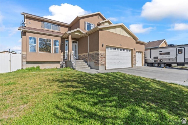 6731 S Ticklegrass Rd W, West Jordan, UT 84081 - view of front facade with stucco siding, an attached garage, concrete driveway, stone siding, and a gate