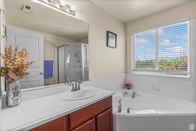 6731 S Ticklegrass Rd W, West Jordan, UT 84081 - full bath featuring a stall shower, a garden tub, and vanity