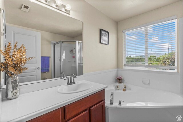 6731 S Ticklegrass Rd W, West Jordan, UT 84081 - full bath featuring a stall shower, a garden tub, and vanity