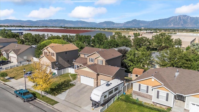 6731 S Ticklegrass Rd W, West Jordan, UT 84081 - aerial view of residential area featuring a water and mountain view