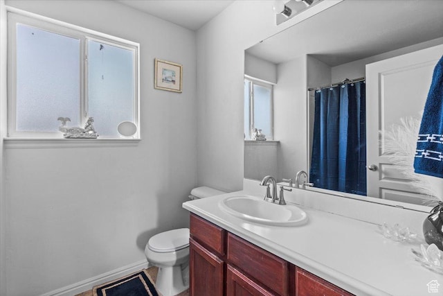 6731 S Ticklegrass Rd W, West Jordan, UT 84081 - full bathroom featuring toilet, vanity, and curtained shower