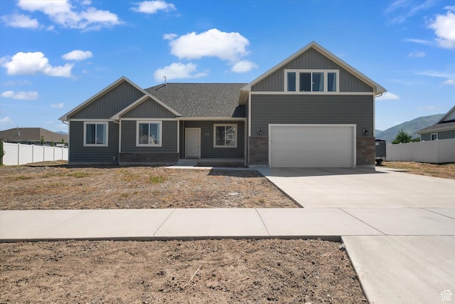 2658 S 1060 W, Nibley, UT 84321 - craftsman-style house with concrete driveway, an attached garage, roof with shingles, and board and batten siding