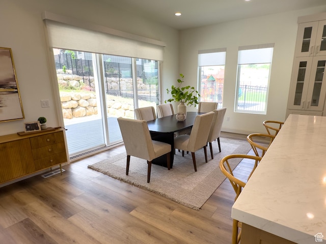 4893 W Ridge Rock Cir, Herriman, UT 84096 - dining area featuring plenty of natural light, light wood finished floors, and recessed lighting