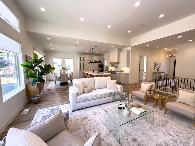 4893 W Ridge Rock Cir, Herriman, UT 84096 - living room featuring recessed lighting, light wood-style flooring, and baseboards