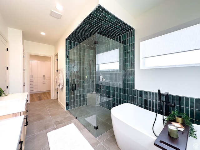 4893 W Ridge Rock Cir, Herriman, UT 84096 - full bathroom with a stall shower, a freestanding bath, vanity, tile patterned floors, and recessed lighting