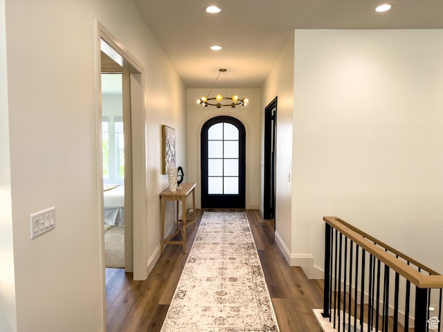4893 W Ridge Rock Cir, Herriman, UT 84096 - entryway with dark wood finished floors, healthy amount of natural light, recessed lighting, a chandelier, and baseboards