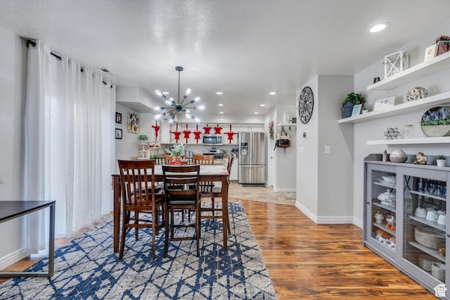 685 E Bullrush Pkwy E, Lehi, UT 84043 - dining space with a chandelier, light wood-type flooring, recessed lighting, and baseboards