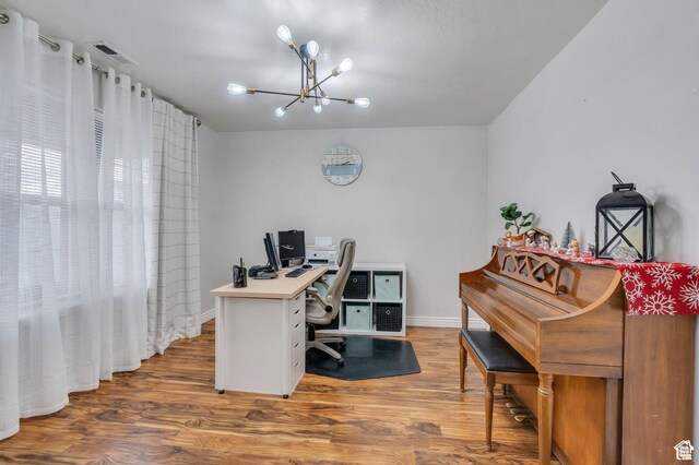 685 E Bullrush Pkwy E, Lehi, UT 84043 - office area featuring a chandelier, wood finished floors, and baseboards