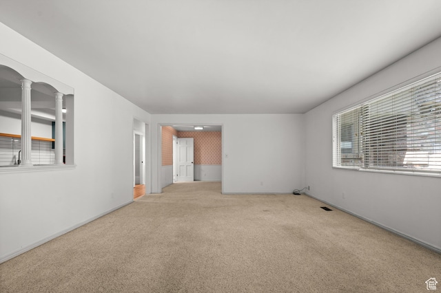 2220 E Murray Holladay Rd Unit 184, Holladay, UT 84117 - unfurnished room featuring carpet, ornate columns, and baseboards
