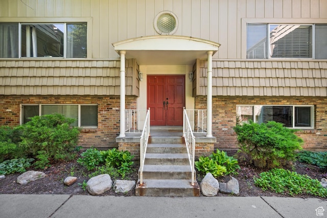 2220 E Murray Holladay Rd Unit 184, Holladay, UT 84117 - view of exterior entry featuring brick siding and mansard roof