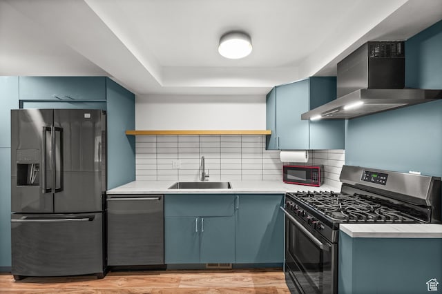 2220 E Murray Holladay Rd Unit 184, Holladay, UT 84117 - kitchen featuring refrigerator with ice dispenser, range with gas stovetop, a sink, dishwasher, and wall chimney exhaust hood