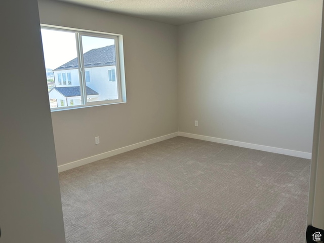 597 W Domanick Way Unit 4, Saratoga Springs, UT 84045 - carpeted spare room featuring baseboards