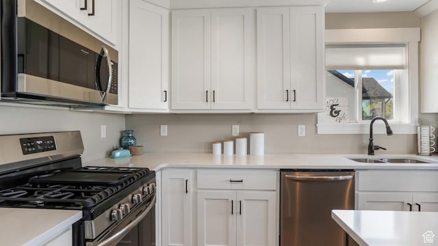 101 E 1500 N, North Ogden, UT 84404 - kitchen featuring appliances with stainless steel finishes, a sink, and white cabinets
