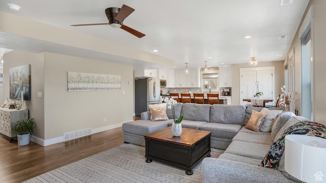 101 E 1500 N, North Ogden, UT 84404 - living area featuring wood finished floors, a ceiling fan, baseboards, and recessed lighting