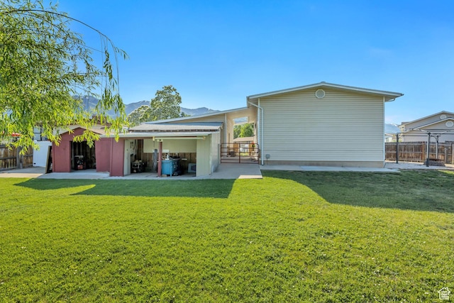 953 E 100 S, Layton, UT 84041 - back of property featuring a mountain view and a patio area