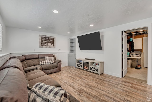 953 E 100 S, Layton, UT 84041 - living room with wood finished floors, recessed lighting, and a textured ceiling