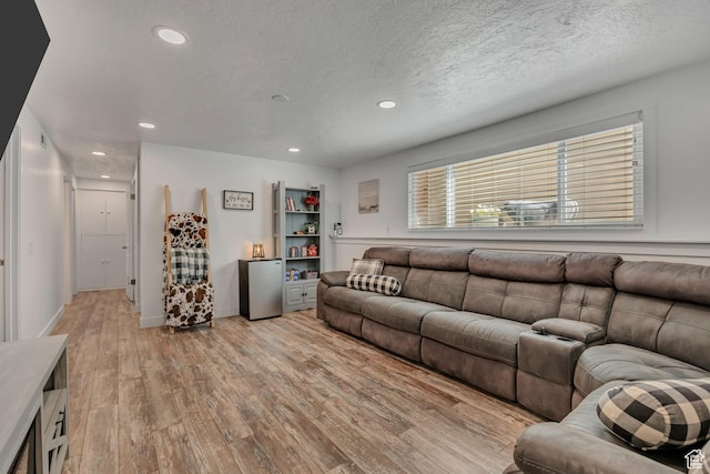 953 E 100 S, Layton, UT 84041 - living room with light wood-style flooring, recessed lighting, and a textured ceiling