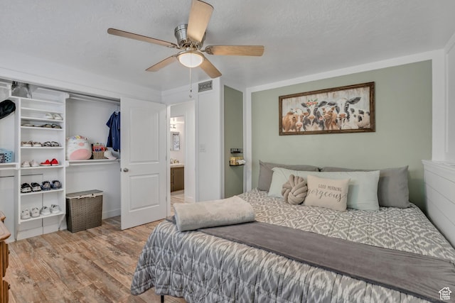953 E 100 S, Layton, UT 84041 - bedroom with wood finished floors, ceiling fan, and a closet