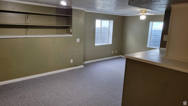 902 W 500 N, Provo, UT 84601 - spare room featuring ceiling fan, dark colored carpet, healthy amount of natural light, baseboards, and ornamental molding