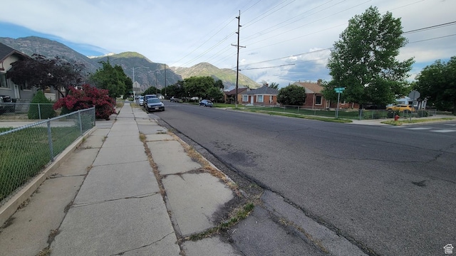 902 W 500 N, Provo, UT 84601 - view of asphalt road with sidewalks, a mountain view, curbs, and a residential view