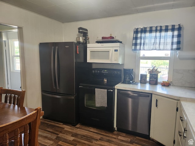 139 E 100 N, Franklin, ID 83237 - kitchen featuring black appliances, dark wood-style floors, light countertops, and white cabinetry