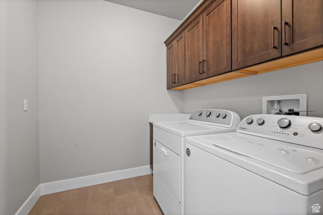 10685 S Dielsdorf Rd E, Sandy, UT 84092 - laundry room featuring cabinet space, washer and dryer, and baseboards