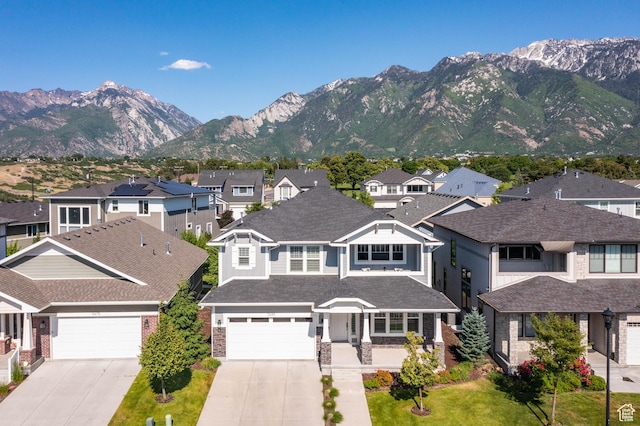 10685 S Dielsdorf Rd E, Sandy, UT 84092 - view of front facade with a residential view, driveway, a mountain view, and a garage