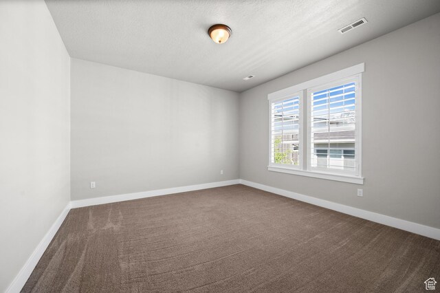 10685 S Dielsdorf Rd E, Sandy, UT 84092 - spare room with carpet floors, a textured ceiling, and baseboards