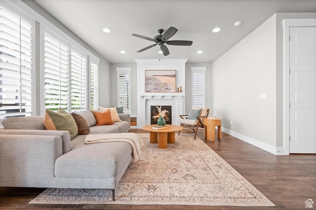 10685 S Dielsdorf Rd E, Sandy, UT 84092 - living room with dark wood-style floors, recessed lighting, baseboards, a ceiling fan, and a brick fireplace