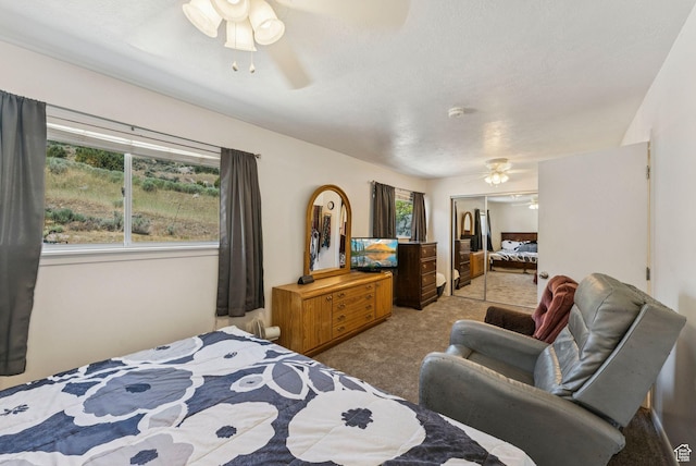 8043 W Hi Country Rd S, Herriman, UT 84096 - bedroom with light colored carpet, a closet, and a ceiling fan