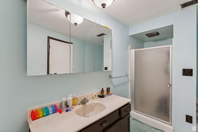 8043 W Hi Country Rd S, Herriman, UT 84096 - bathroom with vanity, a stall shower, and a textured ceiling