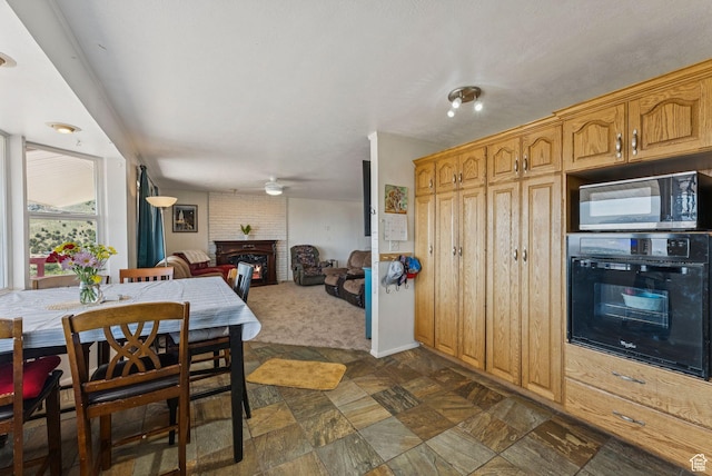 8043 W Hi Country Rd S, Herriman, UT 84096 - dining space with a fireplace and a ceiling fan