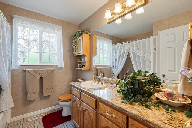963 E 1275 N, Ogden, UT 84404 - full bath featuring plenty of natural light, vanity, toilet, and baseboards