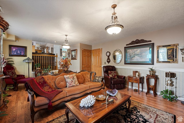 963 E 1275 N, Ogden, UT 84404 - living area featuring wood finished floors and a textured ceiling