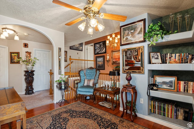 963 E 1275 N, Ogden, UT 84404 - sitting room with wood finished floors, ceiling fan, arched walkways, a textured ceiling, and stairway