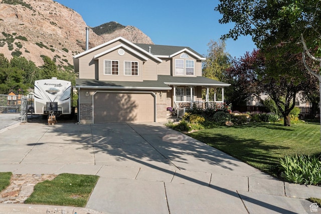 963 E 1275 N, Ogden, UT 84404 - traditional home with covered porch, driveway, a garage, and a mountain view