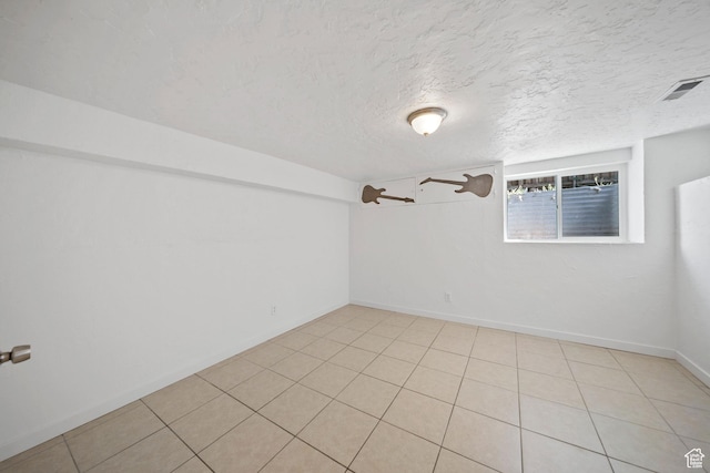 5111 S 1000 E, Murray, UT 84117 - unfurnished room with a textured ceiling, baseboards, and light tile patterned floors