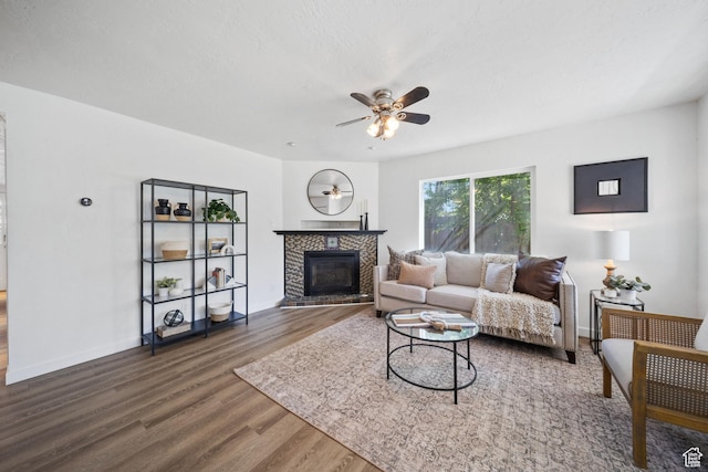 5111 S 1000 E, Murray, UT 84117 - living area featuring ceiling fan, wood finished floors, a fireplace, and baseboards