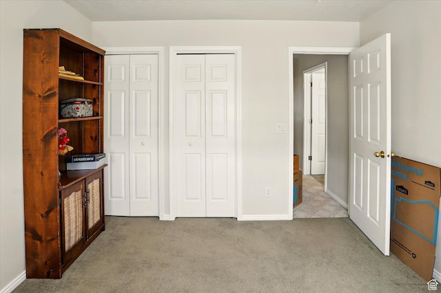913 N 2300 W, Tremonton, UT 84337 - carpeted bedroom featuring multiple closets and baseboards