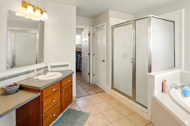 913 N 2300 W, Tremonton, UT 84337 - bathroom with a stall shower, vanity, tile patterned floors, and a garden tub