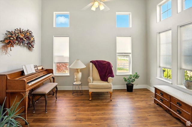 913 N 2300 W, Tremonton, UT 84337 - sitting room featuring a high ceiling, a ceiling fan, wood finished floors, and baseboards