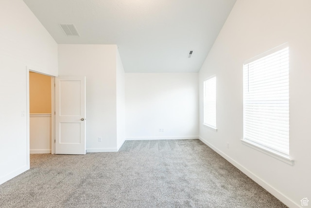 520 S Orchard Dr Unit 17, Bountiful, UT 84010 - carpeted spare room featuring baseboards and vaulted ceiling