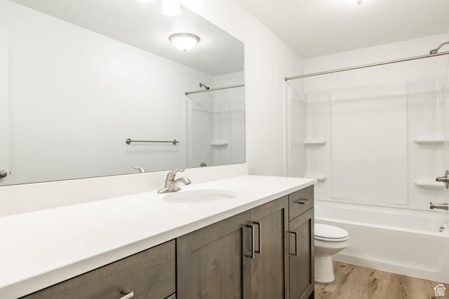 520 S Orchard Dr Unit 17, Bountiful, UT 84010 - bathroom with toilet, vanity, wood finished floors, and bathing tub / shower combination