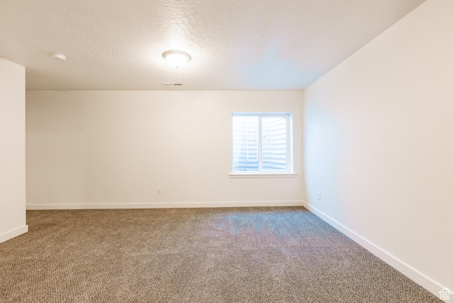 520 S Orchard Dr Unit 17, Bountiful, UT 84010 - spare room with carpet flooring, a textured ceiling, and baseboards