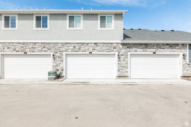 520 S Orchard Dr Unit 17, Bountiful, UT 84010 - view of front of home with stone siding, stucco siding, and central AC unit