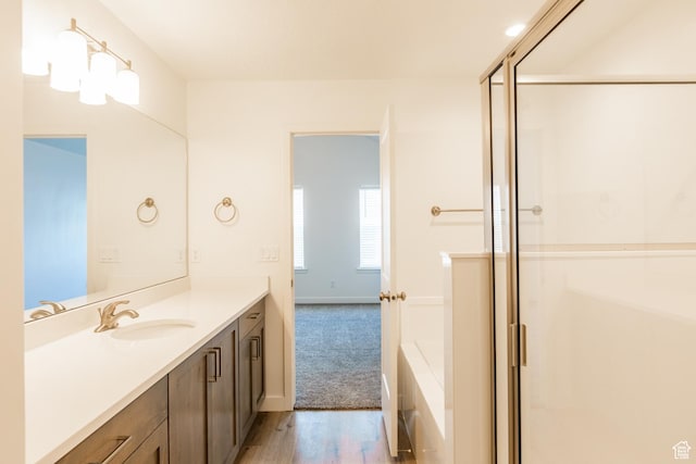 520 S Orchard Dr Unit 17, Bountiful, UT 84010 - bathroom with vanity, a shower stall, wood finished floors, and baseboards