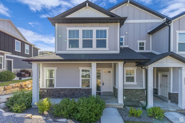 4957 N Marble Fox Way E Unit 118, Lehi, UT 84043 - craftsman house featuring stone siding, roof with shingles, and board and batten siding