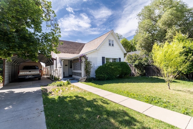 3219 Pingree Ave, Ogden, UT 84401 - view of front facade featuring a detached carport, driveway, and roof with shingles