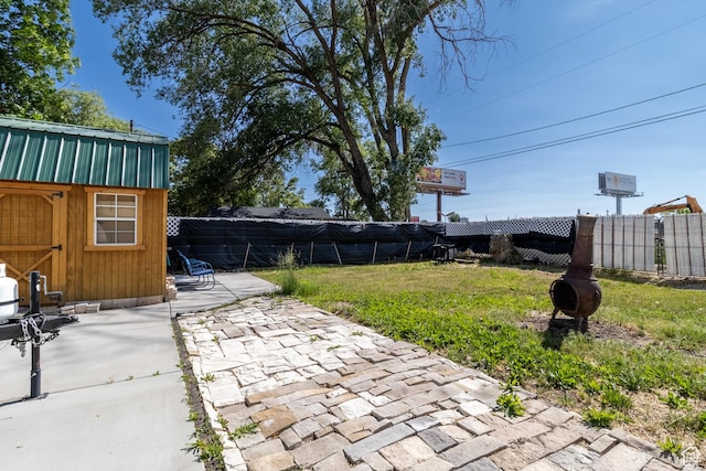 3219 Pingree Ave, Ogden, UT 84401 - fenced backyard with a patio